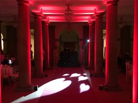 Red uplighting in a venue entrance hall
