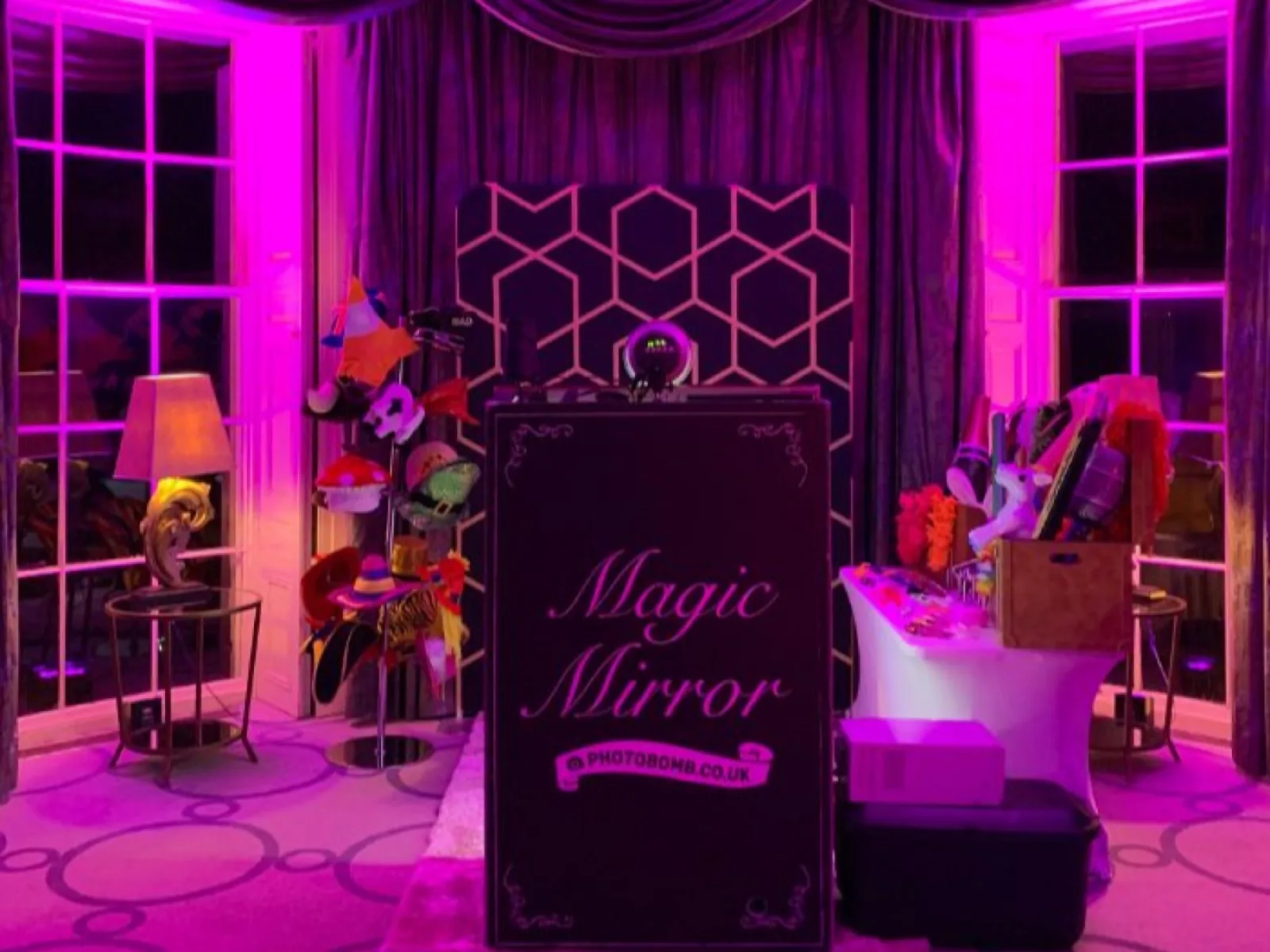 Pink and purple uplighting at a party venue